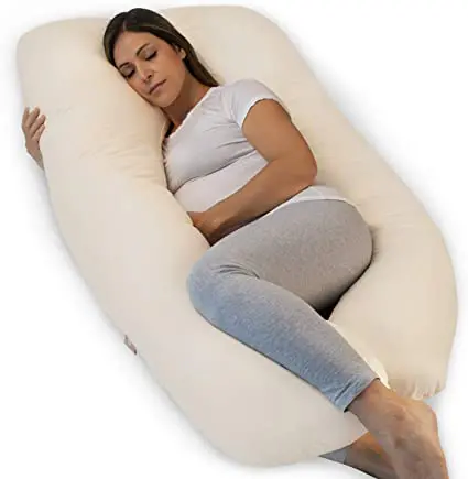 La position pour le coussin de grossesse en forme de U